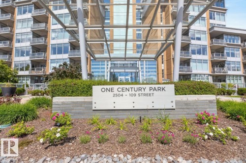 Contemporary high-rise building with a grand entrance featuring a modern canopy structure - #407 2504 109 St Nw, Edmonton, AB - Outdoor With Balcony With Facade