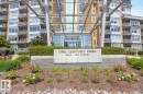 Contemporary high-rise building with a grand entrance featuring a modern canopy structure - #407 2504 109 St Nw, Edmonton, AB  - Outdoor With Balcony With Facade 