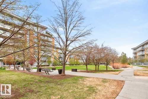 Expansive green space featuring mature trees and paved walking paths - #407 2504 109 St Nw, Edmonton, AB - Outdoor
