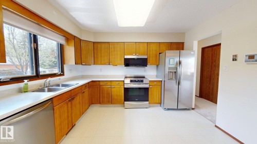 New appliances and garberator in sink - 4521 42 Avenue, Drayton Valley, AB - Indoor Photo Showing Kitchen With Double Sink