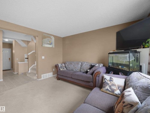 Carpeted living area with neutral wall tones - 16121 131A Street, Edmonton, AB - Indoor