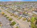 Aerial perspective showcasing a residential cul-de-sac with various single-family homes and townhouses - 16121 131A Street, Edmonton, AB  - Outdoor With View 