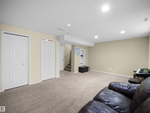 Carpeted lower-level room featuring recessed lighting, light-toned walls, and white trim - 16121 131A Street, Edmonton, AB - Indoor