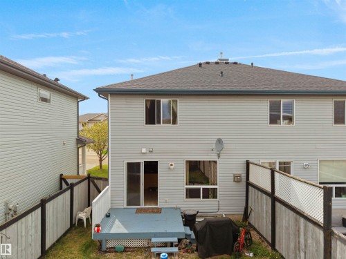 Rear exterior of a two-story residence with light gray siding - 16121 131A Street, Edmonton, AB - Outdoor With Exterior