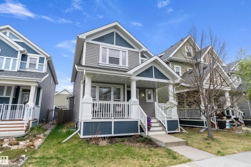 Two-story residence featuring a covered front porch with white railings and columns - 2007 74 Street, Edmonton, AB - Outdoor With Deck Patio Veranda With Facade