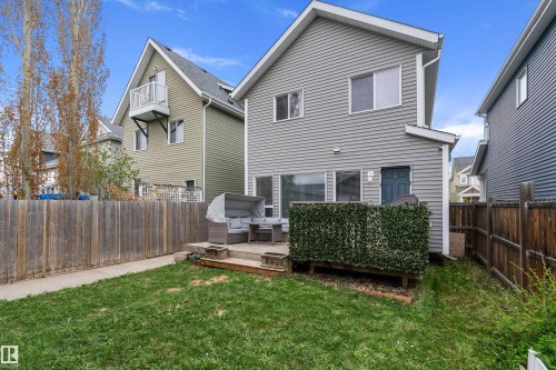 Manicured lawn leading to a rear deck space - 2007 74 Street, Edmonton, AB - Outdoor