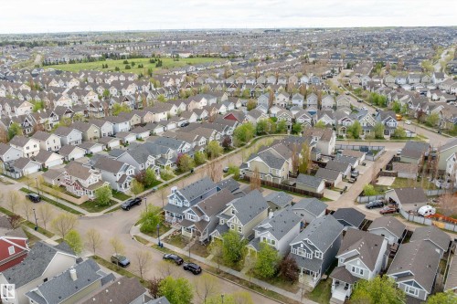 Residential neighborhood featuring a variety of single-family homes, mature trees, and paved streets - 2007 74 Street, Edmonton, AB - Outdoor With View