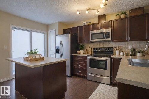 185 1804 70 Street Sw, Edmonton, AB - Indoor Photo Showing Kitchen With Double Sink