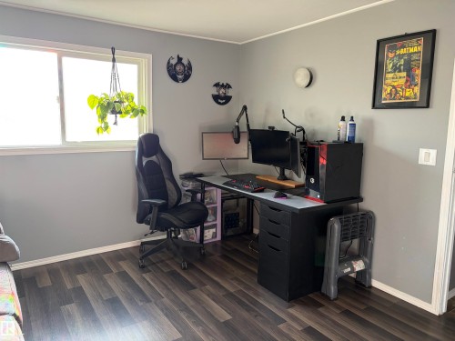 Room featuring wood-finish flooring, light gray walls, and a white trim package - 4108 49 Avenue, Bonnyville Town, AB - Indoor Photo Showing Office