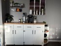 Built-in cabinetry with wood-finish countertop, crisp white doors, and matte black hardware - 4108 49 Avenue, Bonnyville Town, AB  - Indoor 
