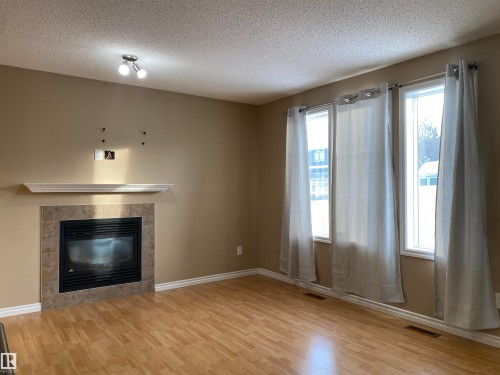 6411 18 Avenue, Edmonton, AB - Indoor Photo Showing Other Room With Fireplace