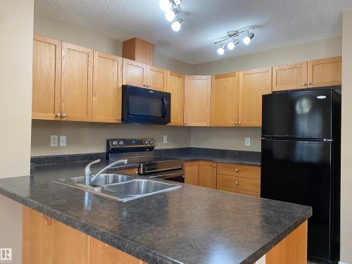 6411 18 Avenue, Edmonton, AB - Indoor Photo Showing Kitchen With Double Sink