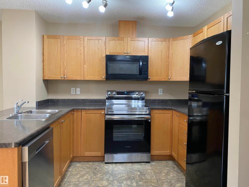 6411 18 Avenue, Edmonton, AB - Indoor Photo Showing Kitchen With Double Sink