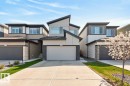 Contemporary exterior featuring a multi-tone facade with dark trim, stone accents, and varied siding - 17347 100 Street, Edmonton, AB  - Outdoor 