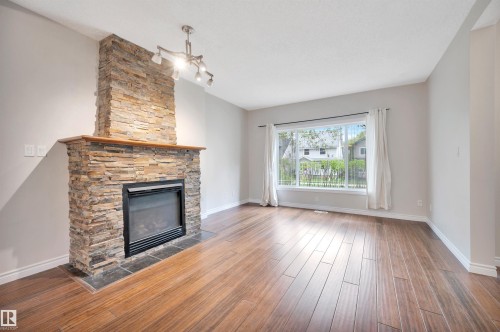 11028 84 Avenue, Edmonton, AB - Indoor Photo Showing Living Room With Fireplace