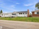 Single-story residence featuring white siding and a dark shingle roof - 13504 116 St Nw, Edmonton, AB  - Outdoor 