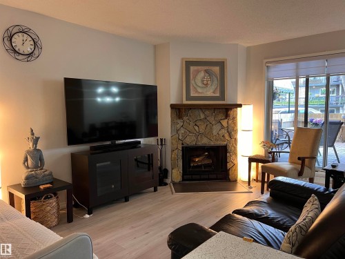 106 10421 93 Street Nw, Edmonton, AB - Indoor Photo Showing Living Room With Fireplace