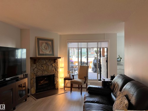 106 10421 93 Street Nw, Edmonton, AB - Indoor Photo Showing Living Room With Fireplace