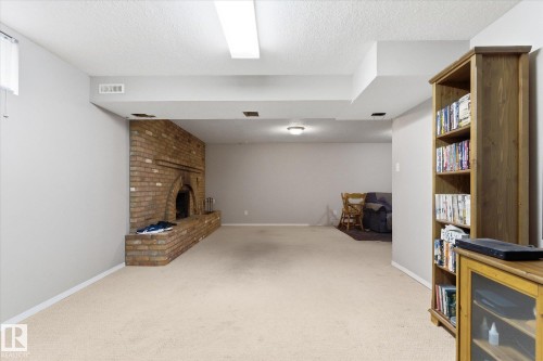 27 Westview Crescent, Spruce Grove, AB - Indoor Photo Showing Other Room With Fireplace