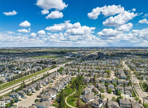 Expansive residential community featuring numerous single-family homes, mature trees, and an extensive road network - 1728 Rutherford Pt Point(E) Sw, Edmonton, AB - Outdoor With View