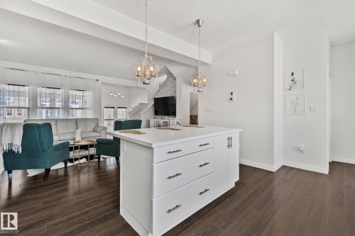 The property features an open-concept layout with dark wood flooring throughout - 336 Southfork Drive, Leduc, AB - Indoor