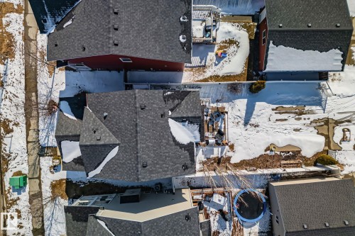 Aerial view of the property showcasing a dark gray shingle roof and a spacious backyard area - 336 Southfork Drive, Leduc, AB - Outdoor