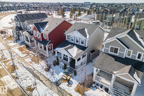 The property features a two-story design with a front porch, a gabled roof, and light-colored siding with white trim - 336 Southfork Drive, Leduc, AB - Outdoor
