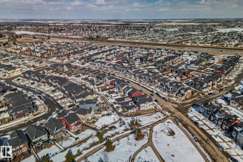 Aerial view of a residential area featuring numerous properties with various exterior colors and roof styles - 336 Southfork Drive, Leduc, AB - Outdoor With View
