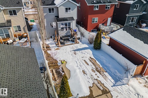 The property features a spacious backyard with a deck and a detached shed - 336 Southfork Drive, Leduc, AB - Outdoor With Deck Patio Veranda