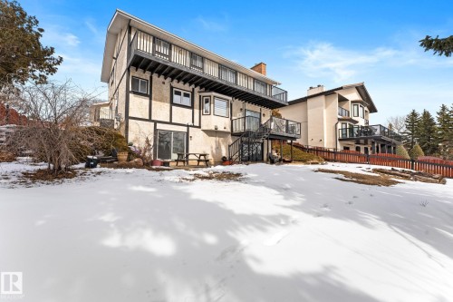 The property features a multi-level design with balconies on the upper floors, and a patio area on the lower level - 10673 161 Avenue, Edmonton, AB - Outdoor