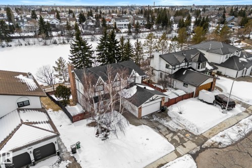 The property presents a distinctive architectural style with a prominent gabled roofline and a notable chimney - 10673 161 Avenue, Edmonton, AB - Outdoor