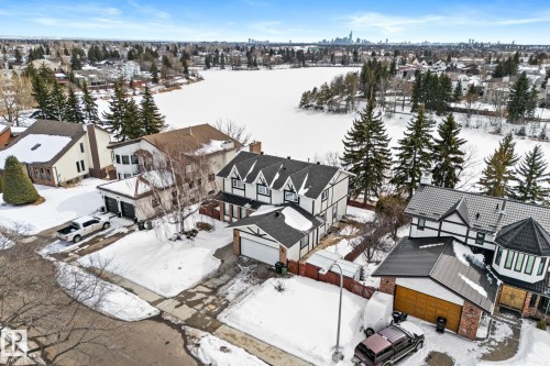 This property features a distinctive Tudor-style exterior with dark trim and a gabled roof - 10673 161 Avenue, Edmonton, AB - Outdoor