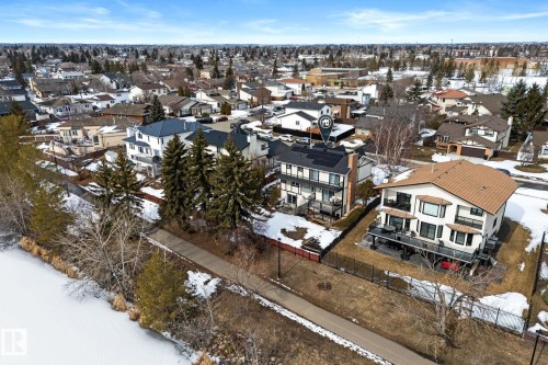 The property features an extensive roof with visible solar panels - 10673 161 Avenue, Edmonton, AB - Outdoor With View