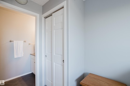White bi-fold doors with panel detailing - 508 11103 84 Avenue, Edmonton, AB - Indoor
