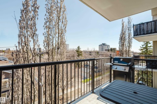 Spacious balcony featuring concrete flooring and a black metal railing - 508 11103 84 Avenue, Edmonton, AB - Outdoor With Balcony With Exterior