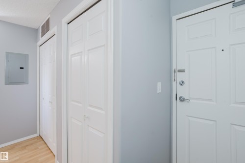 Entryway featuring light wood-finish flooring, light gray walls, and white trim - 508 11103 84 Avenue, Edmonton, AB - Indoor Photo Showing Other Room