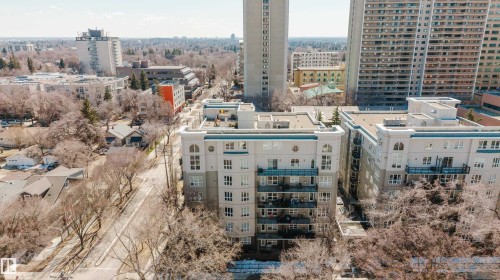 Contemporary multi-story building featuring balconies, arched windows, and a light-colored facade - 508 11103 84 Avenue, Edmonton, AB - Outdoor With View
