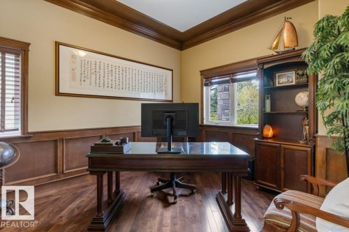 Wood-finish flooring throughout, featuring extensive wainscoting and crown molding - 58 Riverstone Close, Rural Sturgeon County, AB - Indoor Photo Showing Office