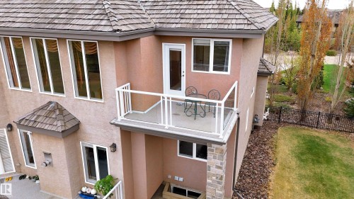Upper-level balcony featuring white railing with glass panels, offering exterior access - 58 Riverstone Close, Rural Sturgeon County, AB - Outdoor