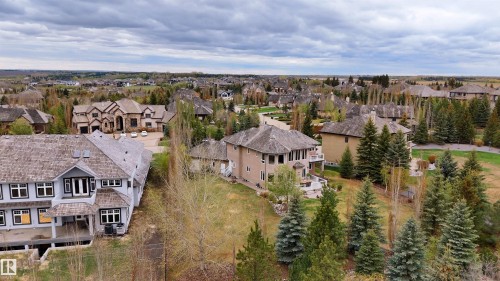 Aerial perspective showcasing residential properties with varying architectural styles - 58 Riverstone Close, Rural Sturgeon County, AB - Outdoor With View