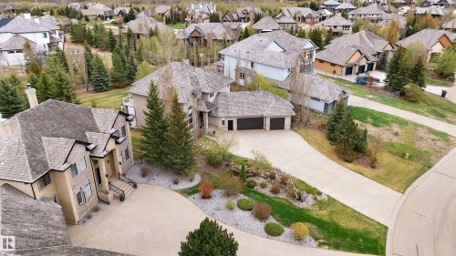Stone and stucco exterior featuring multiple gables and a covered front entry - 58 Riverstone Close, Rural Sturgeon County, AB - Outdoor With Facade