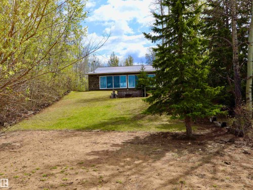 Ranch-style dwelling featuring a metal roof and large picture windows - #26 5508 Twp Rd 593A, Rural Barrhead County, AB - Outdoor