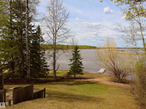 Expansive waterfront property featuring a floating dock and mature trees - #26 5508 Twp Rd 593A, Rural Barrhead County, AB - Outdoor With View