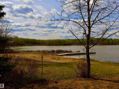 Waterfront property with a private dock extending into the water - #26 5508 Twp Rd 593A, Rural Barrhead County, AB - Outdoor With View