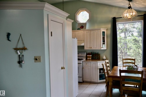 Kitchen area featuring a vaulted ceiling and an octagonal window - #26 5508 Twp Rd 593A, Rural Barrhead County, AB - Indoor Photo Showing Dining Room