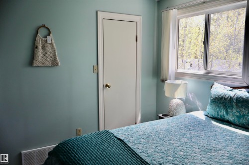 Double-pane window offering natural illumination - #26 5508 Twp Rd 593A, Rural Barrhead County, AB - Indoor Photo Showing Bedroom