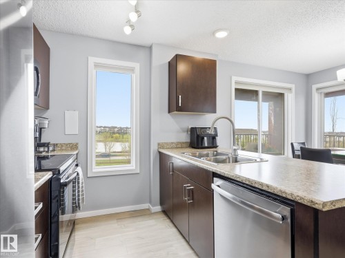 302 5521 7 Avenue, Edmonton, AB - Indoor Photo Showing Kitchen With Double Sink