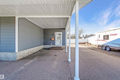 Carport featuring a white corrugated ceiling and support columns - 803 12 Avenue, Cold Lake, AB - Outdoor With Exterior