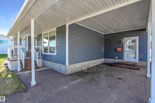 Covered carport with asphalt flooring - 803 12 Avenue, Cold Lake, AB - Outdoor With Exterior