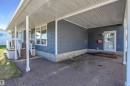 Covered carport with asphalt flooring - 803 12 Avenue, Cold Lake, AB  - Outdoor With Exterior 